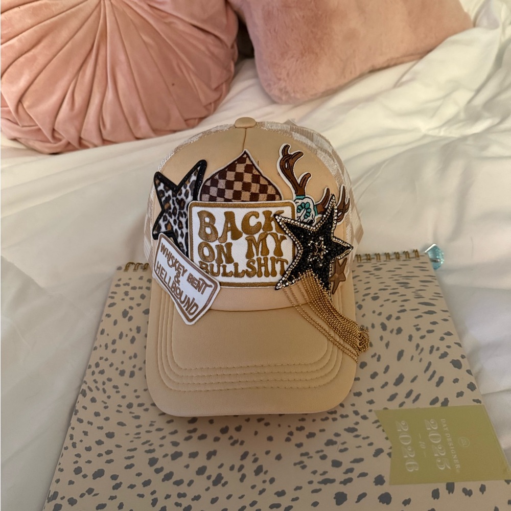 Tan trucker hat with Star and Chain Accents